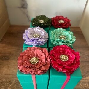 Set of 6 Tieks boxes and flower toppers.
